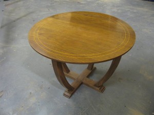 Walnut table with boxwood inlay.